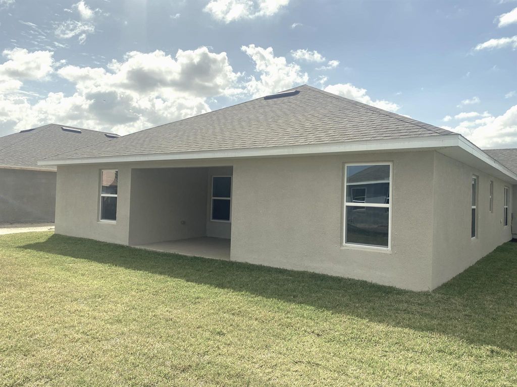 Photo of 8674 Pavia Street S, Fort Pierce, FL 34951 (MLS # R10969044)