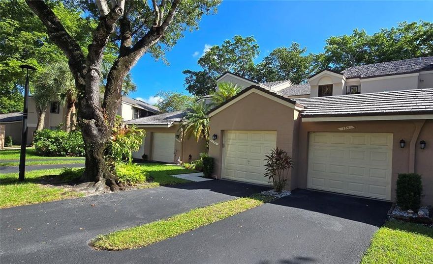 Spacious 2/2 coach home with 1 car garage attached and additional parking outside the garage. Kitchen stainless steel appliances with stackable washer and dryer, tile floor throughout and well maintained. Beautiful screened porch viewing the Lagoon, relaxing atmosphere. Lovely complex in central park area and close to shopping near by. Central park has 2 Olympic pools, tennis, basketball & pickle ball courts, jogging/walking track, exercise room. Convenient to major roads, yet tucked away in quiet very desirable community.