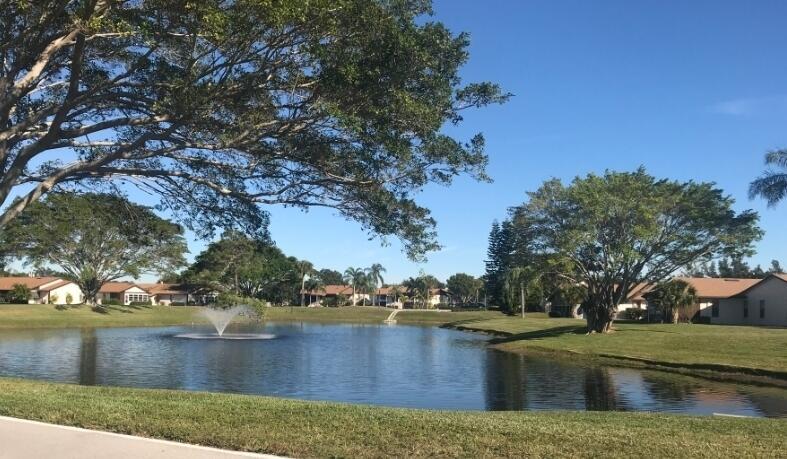 WOW! Absolutely GORGEOUS! Spacious, comfy, 2 Bedrooms, 2 bathrooms condo in southeast Stuart. Close to everything you need. Lake & Pool View! Serene lake, bridge pathway, pool view from your screened patio. BEAUTIFUL upgrades have been done to this one. Light and Bright corner unit. Walk to the pool. This hidden gem is tastefully renovated w/ an Island kitchen with ledger stone backsplash, new bathrooms, and the view is one of the best in the community, if not the best! Carport for rare, covered parking. Washer & Dryer in unit. Quiet community when you want quiet or partake in the fun with the social gatherings. Great and supportive HOA. Amenities include Heated Pool; Clubhouse; Fitness Center; and Game Room. Newer A/C & water heater. Relax in this amazing Stuart condo, Won't last!