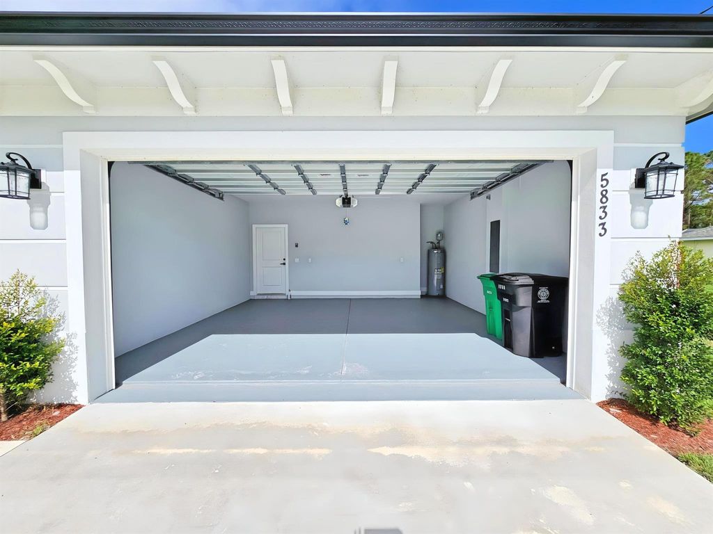 Photo of 5833 NW Wesley Road, Port St Lucie, FL 34986 (MLS # R11036777)