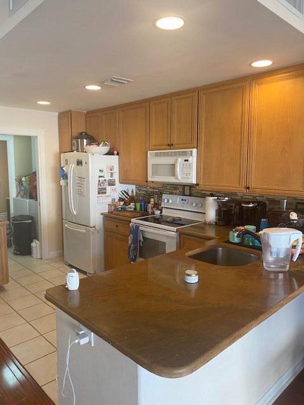 Photo of 164 Poinciana Drive Dr, Jupiter, FL 33458 (MLS # R10689532)