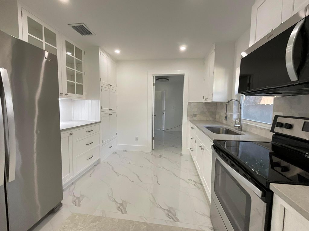 Photo of 700 Tallapoosa Street, West Palm Beach, FL 33405 (MLS # R11129578)