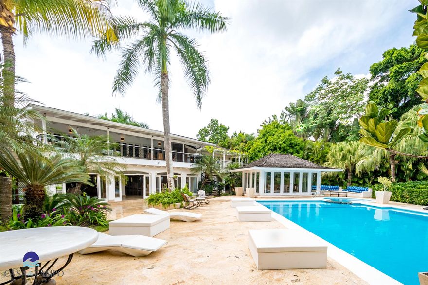 This fantastic five bedrooms, two-level villa on the world-famous Teeth of the Dog golf course in the secluded, wonderfully private Punta Aguila neighborhood boasts an impressive palm-lined front garden that leads you to a double-height entrance and the enchanting villa beyond. Features include spacious living areas with central air conditioning, studio and large dining room table - with a pool, Jacuzzi and outdoor terrace complementing this unique home. This Villa is less than a three minutes drive to the new Caleton Beach Club