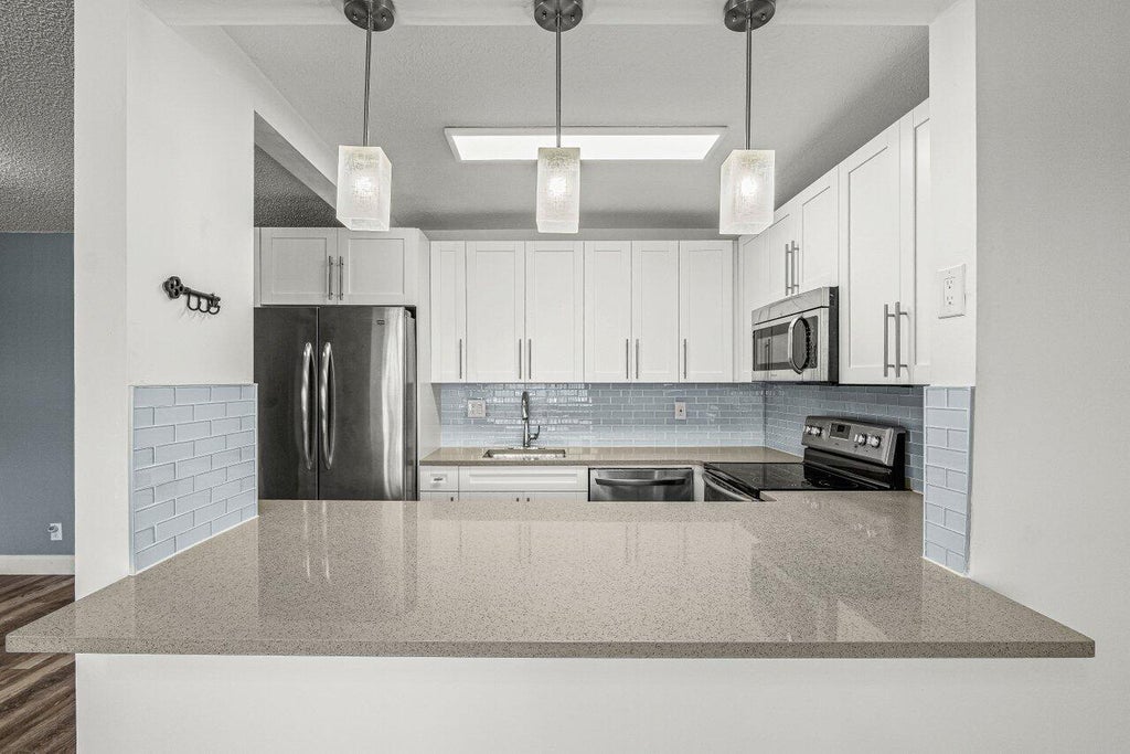 Photo of 700 Village Green Court #319, Palm Springs, FL 33461 (MLS # B26085882)