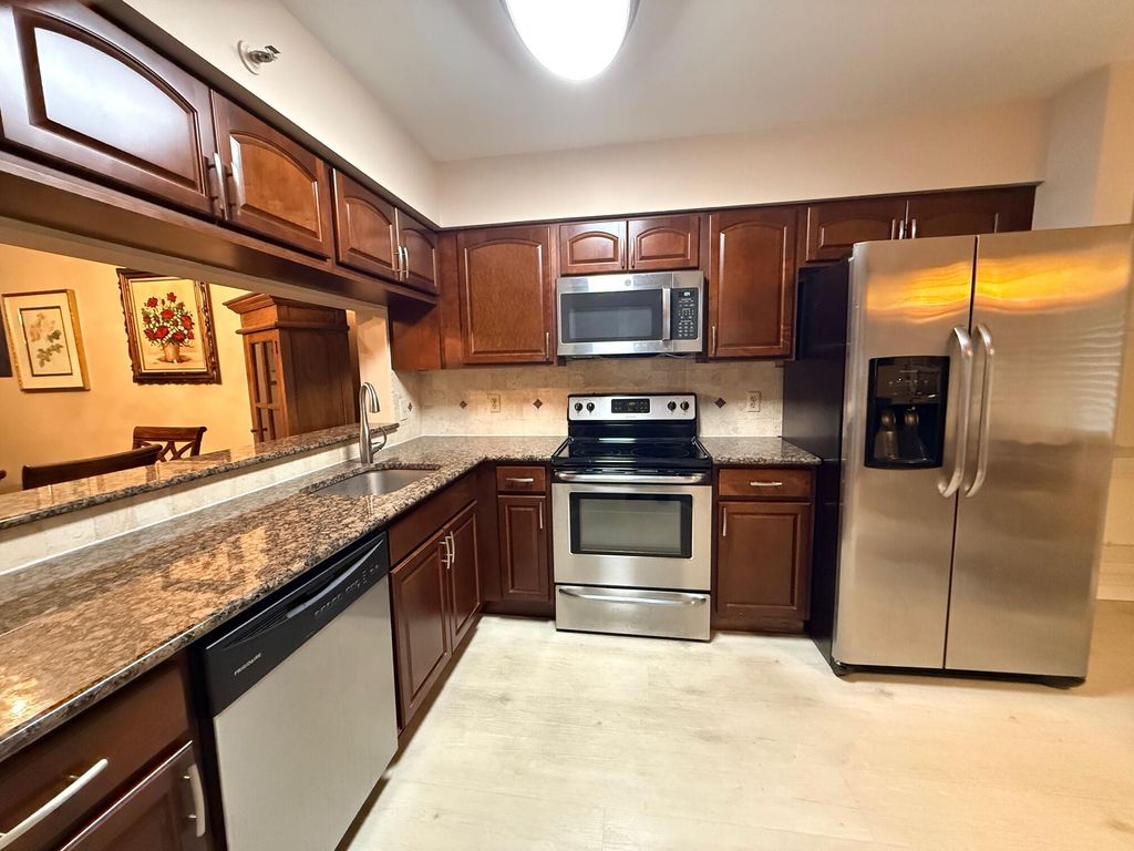 Photo of 14475 Strathmore Lane #103, Delray Beach, FL 33446 (MLS # R11159771)