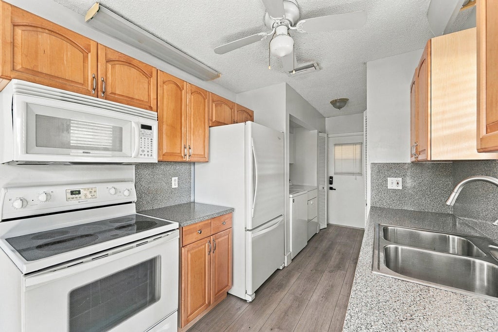 Photo of 1730 NW 48th Place, Pompano Beach, FL 33064 (MLS # B26084957)