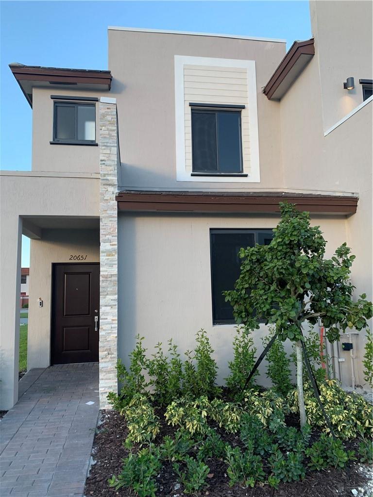 Corner townhome with 1 bedroom & 1 full bath downstairs, two bedrooms upstairs in suite with their own bathrooms. Open kitchen plan kitchen with island, plenty of natural light. Smart home, tankless heater, fenced backyard. Gated community with clubhouse, pool & gym in great location min from Aventura and easy access to I-95. Located in a secure community with 24-hour security.