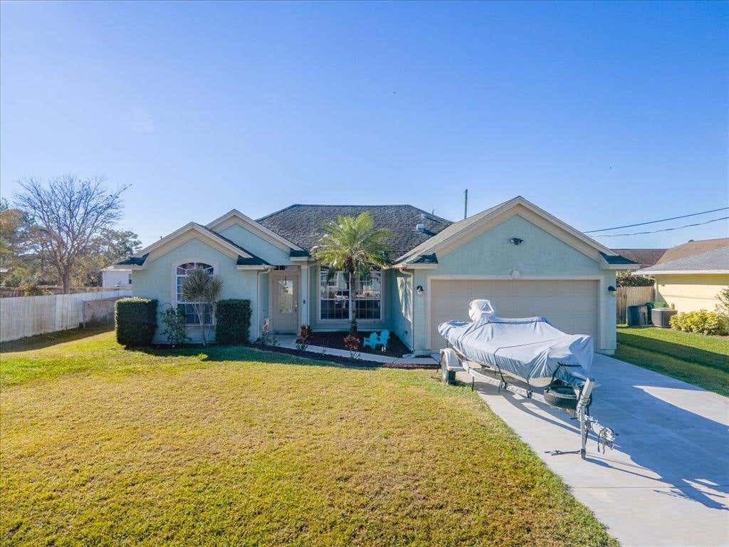 Photo of 1882 SW Inlander Avenue, Port Saint Lucie, FL 34953 (MLS # R10773923)