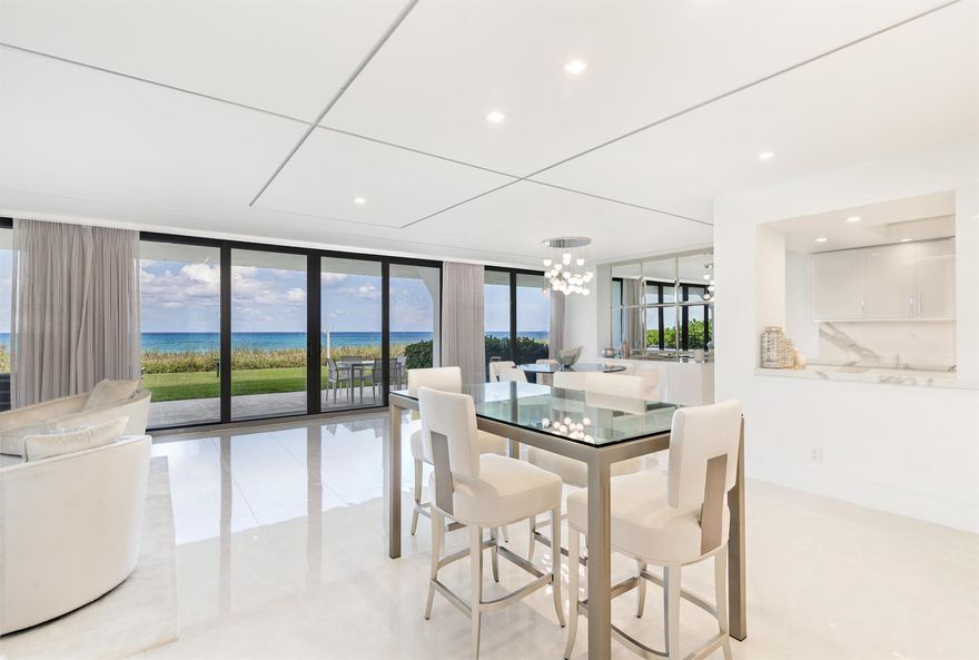 STUNNING NEW RENOVATION WITH DIRECT OCEAN VIEWS!! One-of-a-kind corner residence is perfect for those seek the ULTIMATE PRIVACY. Stunning All White Fully Renovated Palm Beach Direct Oceanfront Condo - lives like a Miami-chic, contemporary beach house - with floor to ceiling glass capturing the incredible Ocean views from major rooms. Bathed in natural light, this 2 bed/2.5 bath plus open den, corner unit boasts over 2,000 sq-ft. and features gorgeous flooring, recessed lighting, oversized shower with soaking tub, automatic shades, contemporary white open kitchen, beautifully backlit wet bar - with views of the Ocean. Ideal for entertaining. Fine finishes in neutral tones make this home paradise. Pristine. Just move in.