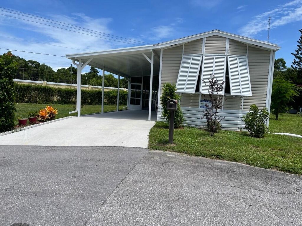 Photo of 10 SE Margarita Lane, Port Saint Lucie, FL 34952 (MLS # R11015090)