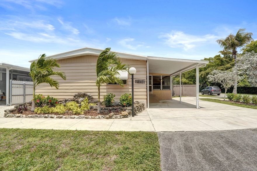 3BR/2BA manufactured home offering approximately 1,585 sq ft of living space on a generously sized lot with the advantage of land ownership (no lot rent). Brand new floors throughout the house! Other features include spacious Florida room providing additional flexible living space ideal for entertaining; large fenced in yard with room for outdoor living or future enhancements; plenty of parking; durable metal roof for enhanced longevity and low maintenance.  Freshly landscaped. A great neighborhood with community pool, playground, and covered areas for larger gatherings. 3/2 corner lot, land is owned.