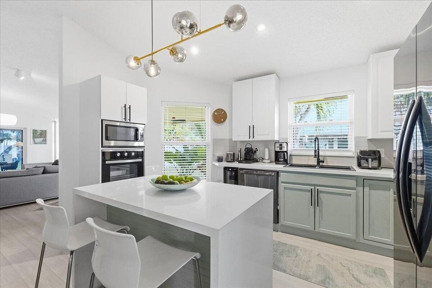 SELLER MOTIVATED! Updated 3BR/2BA 1 story villa in Scarborough in Davie. Oversized  9,000 sq ft lot—rare to find. Open-concept layout, updated kitchen w quartz countertops & new appliances, impact glass throughout w tint, brand new AC & a spacious primary suite w walk-in closet. Enjoy outdoor living w a large covered patio, expansive backyard, & fire pit. 2 car driveway, low HOA w resort-style amenities. Pool, hot tub, lakes, playground, & tennis courts.HOA covers backyard landscaping. NO HOA APPROVAL REQUIRED. Pet-friendly community conveniently located minutes to I-595, Nova, top A rated schools, shopping, dining, & FLL Airport. Additional upgrades  incl custom lighting imported from Spain & France. SELLER willing to offer CONCESSIONS at closing towards closing costs. new door levers, deadbolts, and hinges throughout, and an ADT security system with cameras. HOA covers landscaping in the front and backyard.