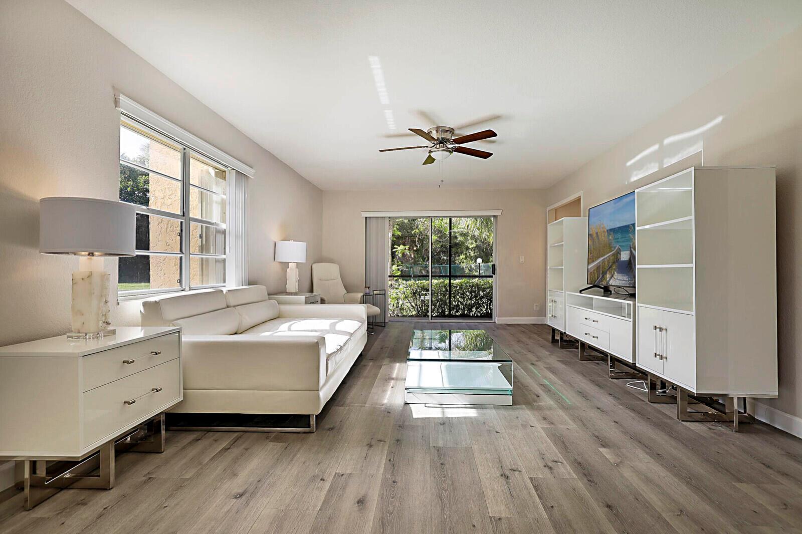 Stylish, Renovated & Move-In Ready! This designer-furnished 2-bedroom, 2-bath corner unit has been beautifully renovated with attention to every detail. Overlooking a serene nature preserve, the screened porch is the ideal spot to relax and unwind. Enjoy an updated kitchen with granite countertops, coordinating backsplash, brand-new stainless-steel appliances, and a full-size washer/dryer in-unit. Both bathrooms have been tastefully updated, and the unit features new lighting, newer A/C, and hurricane shutters for peace of mind. Your covered carport is right out front for added convenience. Enjoy resort-style living with access to a clubhouse, pool, gym, spa, recreation room, tennis, and pickleball courts. Centrally located near beautiful beaches, top restaurants, shopping, and