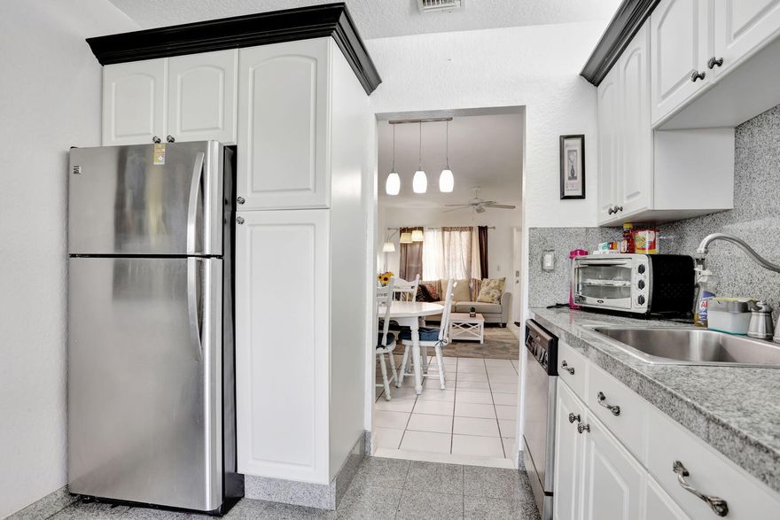 Beautifully maintained 1-bedroom, 1.5-bath unit located in a desirable 55+ South Florida community. This residence features a renovated kitchen, a spacious primary bedroom, and a private enclosed balcony—perfect for relaxing or enjoying the peaceful surroundings.  The additional half bath offers added convenience for guests. Residents enjoy access to a wide range of amenities, including social events, recreational facilities, and lush, well-maintained landscaping. The unit is offered fully furnished, with furnishings available for separate negotiation. This move-in-ready home presents an excellent opportunity to enjoy the comfort, charm, and active lifestyle of South Florida senior living.