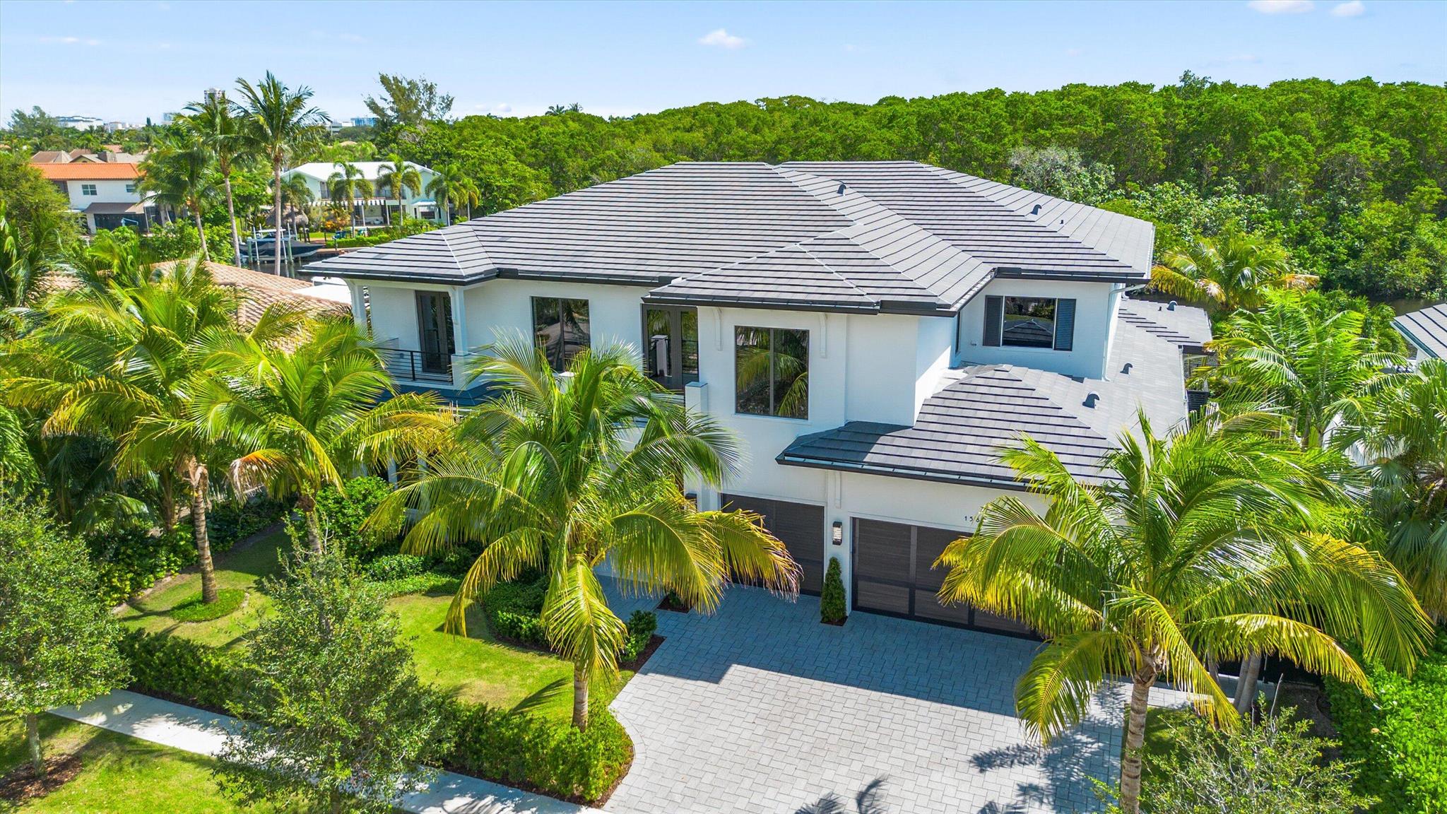 Welcome to Carriage Hill, East Boca RatonExperience extraordinary living in one of Boca Raton's most desirable neighborhoods--just minutes from pristine oceanfront beaches, beautiful public parks, The Boca Raton Resort, downtown Mizner Park, and Royal Palm Place for shopping and dining.This newly built waterfront estate perfectly blends luxury, privacy, and modern design. Overlooking the tranquil El Rio Canal and a lush preserve, this home provides a rare sanctuary setting with uninterrupted natural views--offering peaceful seclusion and exceptional privacy from your pool and backyard. Featuring five en-suite bedrooms, a second-floor club room, and 93 feet of waterfront with a brand-new seawall and 73-foot composite dock, this residence is designed for elegant entertaining an