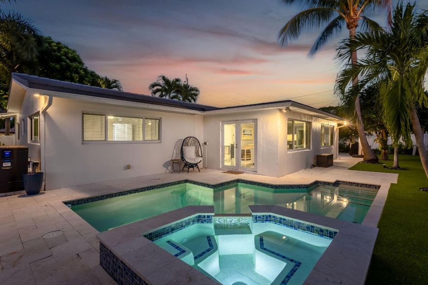 Step into coastal living in this fully renovated Lighthouse Point corner-lot gem. Features include a 2015 tile roof, full impact windows, 2025 A/C and new ductwork, and elegant tile flooring. Sun-filled interiors offer a spacious primary suite and a bright Florida room. Enjoy a resort-style backyard with turf, a heated pool, updated equipment, and a relaxing hot tub—perfect for entertaining. South-facing exposure brings all-day light. Minutes to marinas, parks, dining, Boca, and Fort Lauderdale.