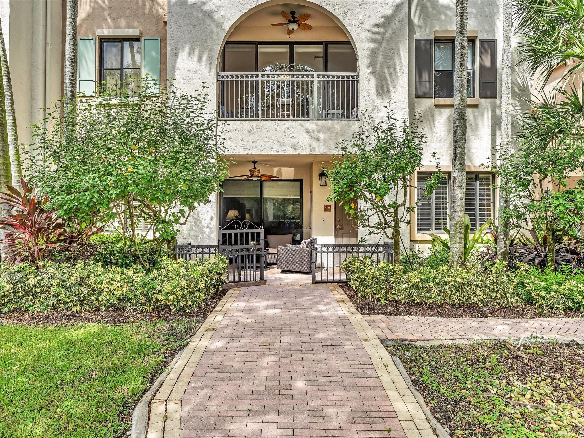 This stunning Artesia Botanica model offers the ultimate in luxury and convenience. Experience townhouse-style living within a secure building - no elevators needed with direct ground-level access! This highly desirable and rarely available floor plan features 2 bedrooms, 2.5 baths, plus versatile den converted to 3rd bedroom. Gourmet kitchen showcases rich wood cabinetry, granite countertops, and stainless steel appliances. Elegant wood-like flooring throughout. Cedar wood accent wall. Custom shelving in all closets. 5 ton a/c unit (2023). New light fixtures & fans. Impact doors & windows. Expansive master suite boasts dual vanities in the spa-like master bath. Exceptional convenience with 2 assigned covered parking spaces directly next to your private back entrance. Don't miss this one!