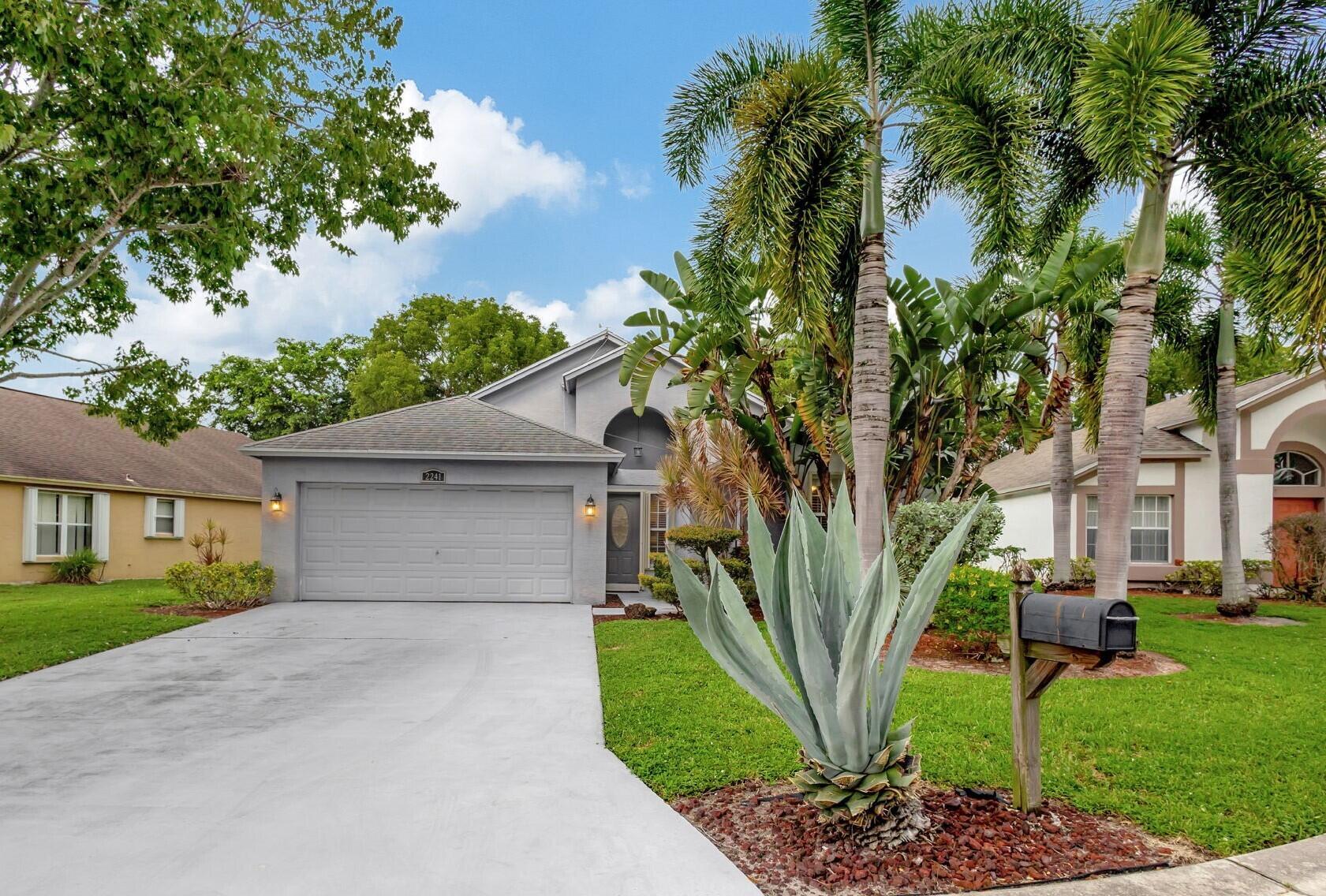SEASONAL RENT!🏡 Escape to your perfect winter retreat at 2241 Soundings Ct in Greenacres, FL, where sun-filled days and luxurious comfort await. This beautifully appointed 3-bedroom, 2-bathroom home is nestled in the prestigious River Bridge community, offering a warm and inviting atmosphere that feels like a tropical getaway. As you step inside, you'll be greeted by an open, airy layout with soaring ceilings, nicely furnished, and abundant natural light filling every room. Step outside to your screened and tiled porch, where you can sip your morning coffee while soaking in the lush garden views, or enjoy an evening breeze with a glass of wine. The home is located next to Okeeheelee Park and Golf Course. River Bridge is a resort-style gated community. Read more