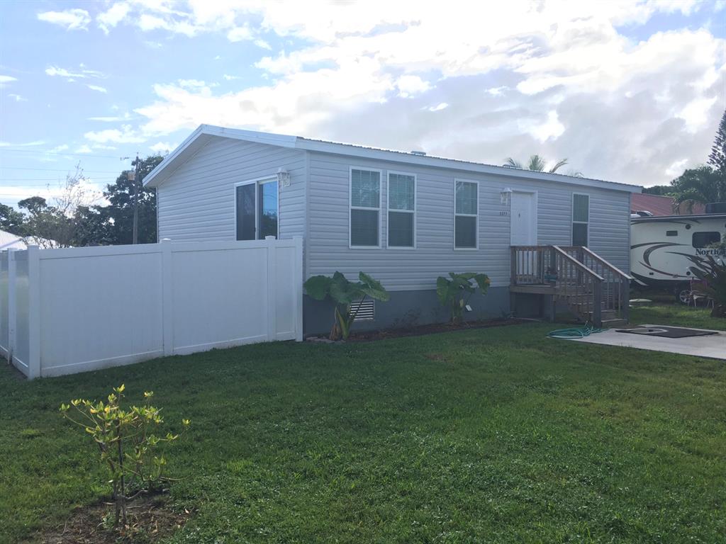 BRAND NEW home on a HUGE corner lot in the beautiful Port Salerno neighborhood. Bring your pets, bring your boats! Huge backyard with new fencing, great access for trailers/boats/etc. All new manufactured home built in 2019, everything is new and lightly lived in while owners planned their retirement! This one will not last!