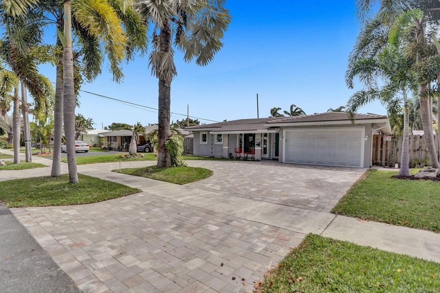 Beautifully renovated 3-bedroom, 2-bathroom home in a prestigious Pompano Beach location, less than 10 minutes from the beach. This move-in ready property features a bright, modern interior with stylish finishes throughout. Major upgrades include solar panels, a brand-new 2025 A/C system, and impact windows throughout for energy efficiency and peace of mind. The backyard offers a resort-style setting with a tiki hut and BBQ area, perfect for entertaining family and friends. Ideal for families, seasonal residents, or investors, this home is being sold turn-key, offering immediate enjoyment or excellent rental potential in a prime South Florida location.