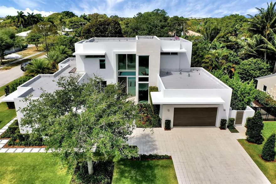 Two year young modern architectural masterpiece! Better than new. All of the extras are included! 250 bottle built-in wine storage, solar shades throughout, fully built out closet systems, custom built-ins, designer wall coverings. Upgraded appliance package with Wolf gas cook top, double ovens, warming drawer, 2 Sub Zero beverage refrigerators, Thermador fridge & freezer. First floor master suite, office/wine room, den/breakfast room, formal dining and huge great room leaves plenty of space to spread out. One of a kind dramatic floating staircase! 2nd story features 3 additional bedrooms, all with walk-in closets and en-suite baths, plus a loft/study/play area. Relax by the heated salt water pool, outdoor living room & summer kitchen, with convenient cabana bath & outdoor shower. Other