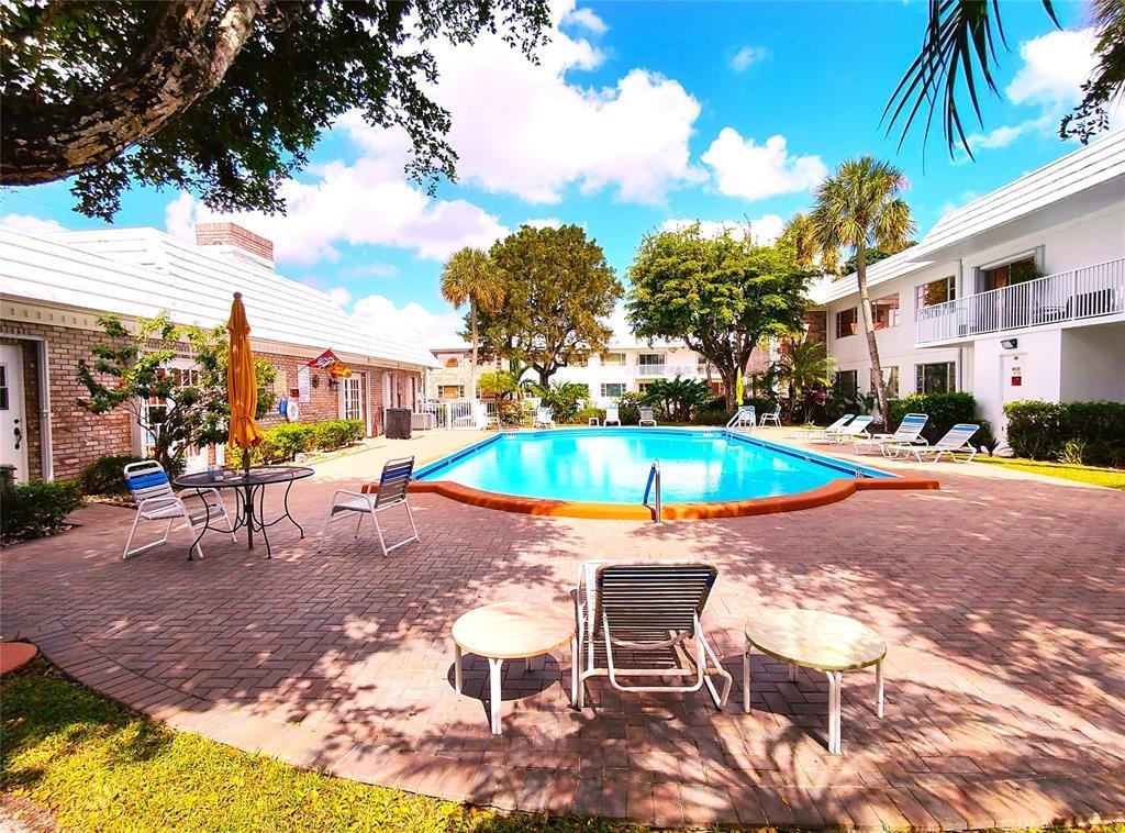 Lovely 1 bed 1.5 bath located in the heart of Pompano Beach in a well-maintained community. This property is a 1st floor unit and has a spacious layout and lots of light & located on the north side of the building. Centrally located close to shopping, minutes to the beach, restaurants & highways. Pompano Beach has transformed its beaches into a resort village complete with a water taxi, newly constructed fishing pier, oceanfront dining, children's waterpark, playground, & workout facilities. Don't miss this opportunity to become a part of one of South Florida's hottest cities! Community amenities include a large clubhouse, beautiful community pool, shuffleboard & is a very active & thriving community!! Motivated Seller.