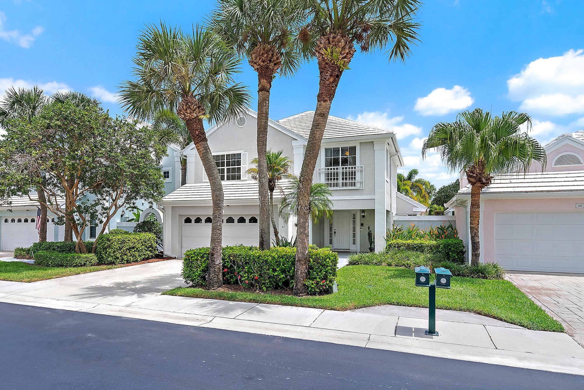 Welcome to your South Florida retreat in the highly sought-after Barclay Club at PGA National, a premier resort-style community where membership is optional. This spacious 3-bedroom, 2.5-bathroom home with loft/flex space offers over 2,100 sq. ft. of comfortable living, perfectly designed for both seasonal or year-round living.As you enter, you're greeted by soaring 20-foot ceilings and a dramatic, freshly painted fireplace wall that sets the tone for the home's airy, inviting feel. A fully enclosed Florida room off the living area creates true indoor/outdoor living and expands your entertaining space. The primary suite on the first floor includes a private atrium off the bathroom--ideal for sunbathing, a sauna, or lush landscaping.