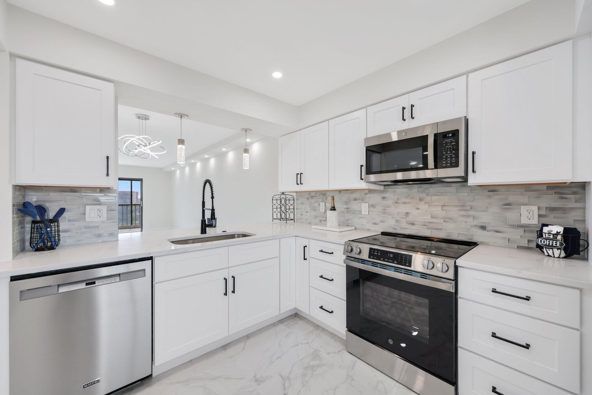 Welcome to your dream 2 bed, 2 bath LARGE FLOOR PLAN condo in a vibrant 55+ lifestyle community! This gem has undergone a full remodel, ensuring a modern living space where you will be the first resident. The open-concept kitchen is a showstopper, featuring stunning quartz countertops and custom cabinetry. Beautifully tiled floors add elegance throughout the home. Custom ceiling lighting brightens up the living area. Enjoy breathtaking 7th floor views of the lake and surrounding homes from your living space or balcony. Both bathrooms have been beautifully transformed with taste and functionality. Double vanity in the primary. The beautiful tile floors extend into the bedrooms as well as custom walk-in closets. No detail has been overlooked, from fresh paint to the smooth ceilings.