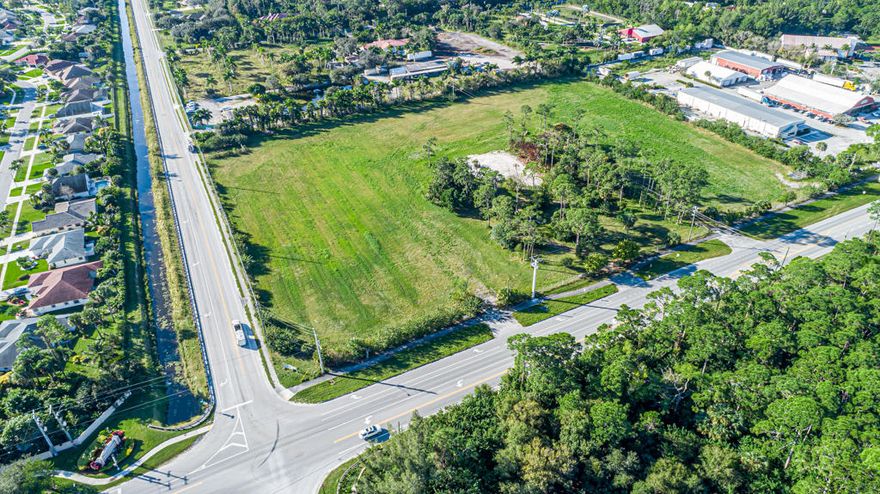 This is an incredible opportunity to own and develop right in the middle of the growing western communities. With Royal Palm Beach to the East and all of the development to west such as Westlake and Wellington to the South you can not go wrong with this location. The site plan has already been approved through the Town of Loxahatchee Groves. The Commercial Zoning has already been approved. The approval is for 30,000 SF mixed use with 700 sq ft frontage on Okeechobee Blvd. Approved for a restaurant, a drive through restaurant/ doughnut shop and office buildings. The site plan drawings have been completed and the site is ready to build. If your looking for a project that is ready to go this is it.
