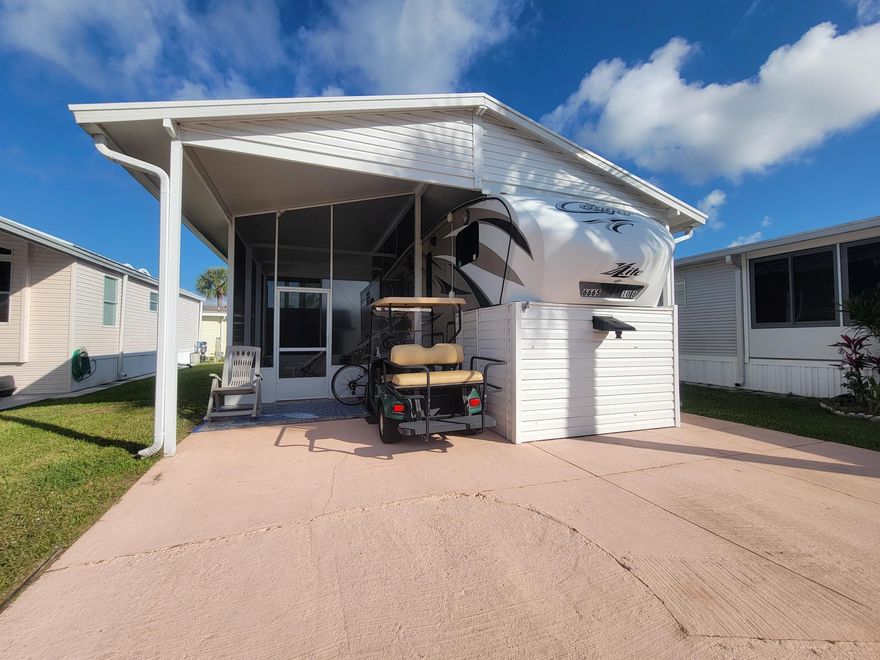 Ancient Oaks 55+ Community! This 2014 High Country Cougar Lite 5th wheel offers 1 bed, 1 bath, 3 slide-outs, and a roof-over.  Features include a center island with a sink, an electric fireplace, and a spacious bath with a walk-in shower. Enjoy the brand-new 12x18 screened porch and ample storage, including an outdoor shed.