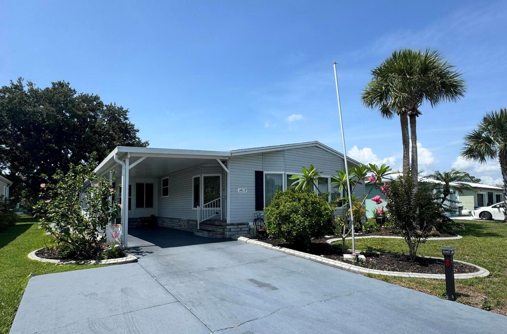 Lovely and Immaculate 2 bedroom 2 bath home in the desirable Spanish Lakes 55+community. Home has beautiful landscaping! Home has large living as well as family room. Open kitchen with island. Home is perfect for those looking to entertain or just wanting extra space. Wet bar off kitchen, Beautiful lania with windows that can open to screened in area or closed. Perfect for morning coffee or evening cocktails. Home has a shed off the back for extra storage. Home has a very private and peaceful backyard. Roof is 2014, A/C 2014, Water Heater 2022. Plumbing and vapor barrier have been replaced. Washer and Dryer 2023. Lawn care and trash removal included in lot rent. 2 pools, tennis, pickleball, bocceball, shuffle board. club house 18 hole golf course and much more. MUST SEE!