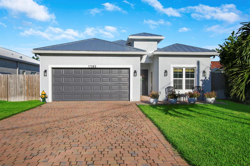 FOR RENT! NEWLY CONSTRUCTED single family home with tons of upgrades in Jupiter, FL! Zoned for A-rated schools, NO HOA and located right off of Indiantown Road right across from the Dog Park!You'll love this home! It offers 3 bedrooms with a den/office, 2 full bathrooms and a half bath, a 2 car garage, large covered back patio and a fenced yard! In addition, you'll be sure to enjoy Impact glass windows and doors, a standing seam metal roof, paved driveway, front and back patio, gorgeous tile, modern kitchen with quartz tops and top-of-the line Stainless Steel appliances. Pets will be considered on a case by case basis. Available September 1st!