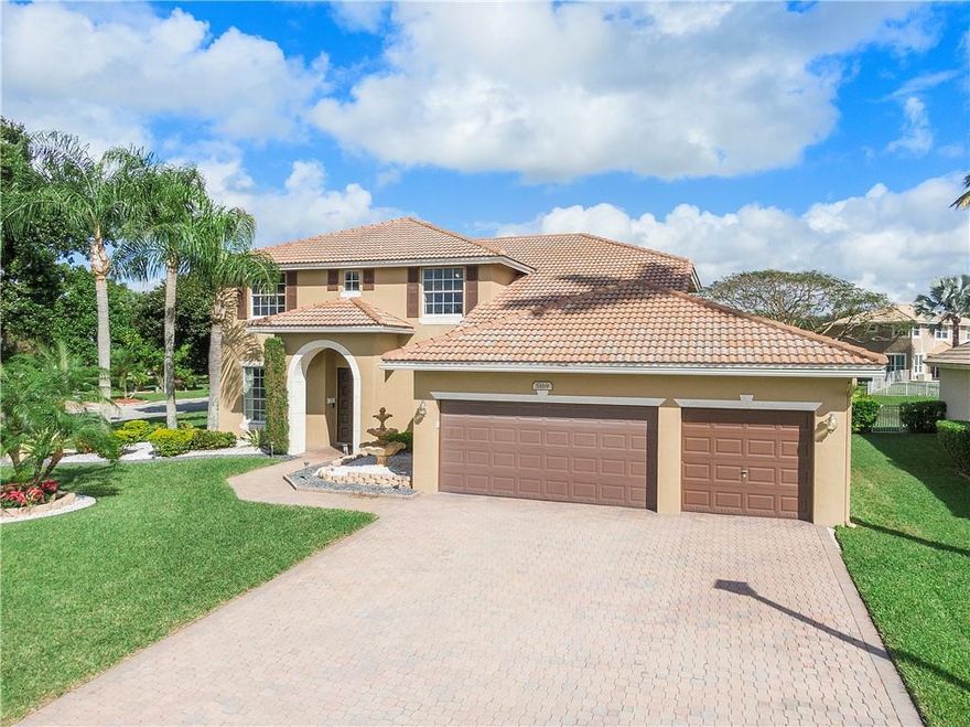 Meticulous 5 bed, 3 bath home w/ 3-car garage, beautiful water views & huge corner lot, is move-in ready! One-owner home features open concept first floor, upgraded finishes including high-end 'wood' & tile flooring throughout. Bedroom & full bath located on FIRST FLOOR! Light & bright, eat-in kitchen w/ white cabinetry & SS appliances, is the heart of the home. Open living space is perfect for movie nights on the couch or any large gathering! Elegant, formal dining area greets you as you enter. Separate living room can be used as office or fitness area. Second floor features 4 bedrooms, 2 bathrooms & plenty of closets! Double door, master bedroom is fit for royalty! It features oversized ensuite w/ 2 walk-in closets, standing shower, soaking tub and dual vanities! Supplement cont. Enjoy your morning coffee on your large, screened patio w/amazing water views. Huge backyard oasis is perfect for year-long entertaining and plenty of room for a pool! This GATED community features a LOW HOA and close to everything Coral Springs and Parkland!