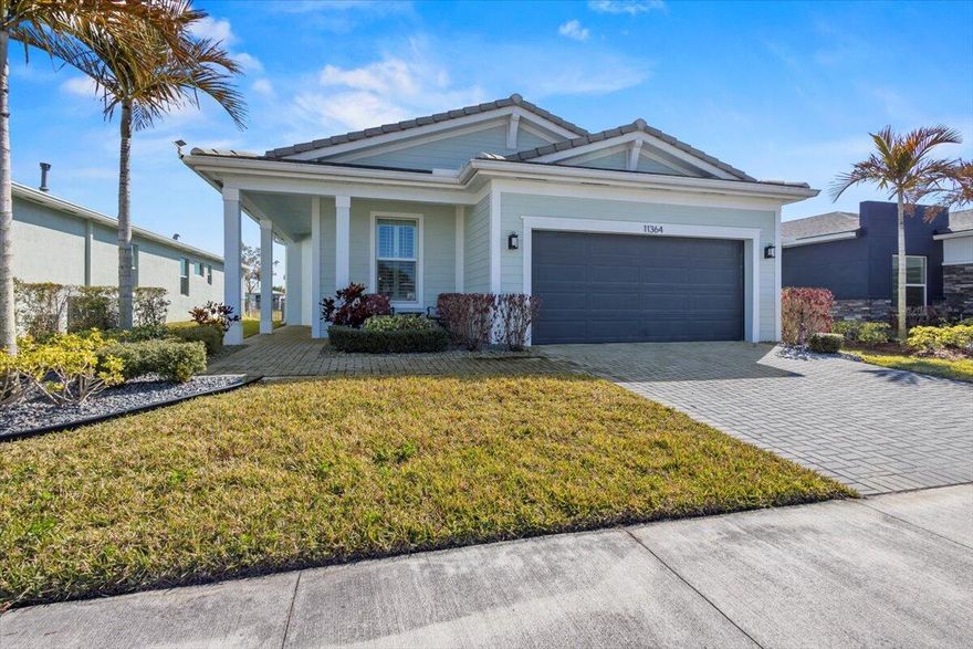 This comfortable, contemporary home in the heart of Tradition has  numerous upgrades from concrete tile roof, whole house Generac generator, to the remote porch screen for storms & privacy ,  the ring doorbell & cameras, and the durable epoxy finished garage floor. Many more features are listed in the document section. The extras set this home apart from the standard build.  Then there is the  pool setting ,the main attraction, with a view over the water and the fire water bowls for that tropical sensation. Umbrella stand  + chairs are yours, so bring your plastic glass and favorite drink! It will be warm soon, meanwhile the pool can be  heated until temperatures rise.  The den can be made easily in to a 3rd bedroom. Measurements approx., rules and regs in document. HOA offers a dog park!