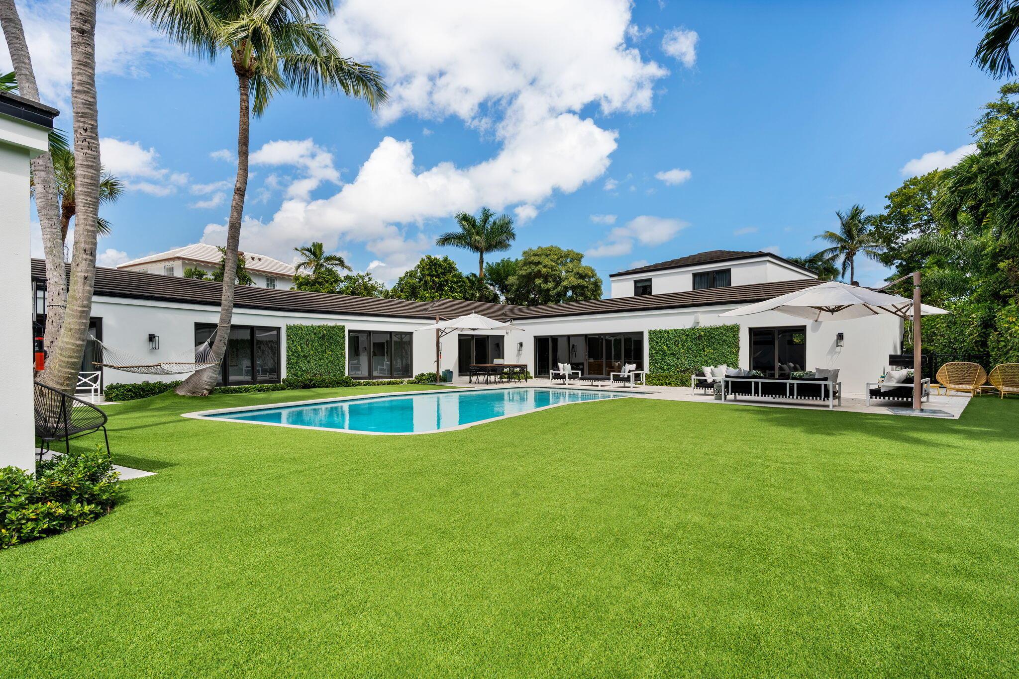 Prepare to be captivated by this thoughtfully remodeled 5-bedroom, 5.2-bathroom Mid-Century Modern residence. Nestled on a generous 17,800 +/- square foot lot in the highly sought-after North End of Palm Beach. An Art Collector's dream with an abundance of walls to showcase your prized pieces. The heart of the home is undoubtedly its gourmet chef's kitchen. Boasting an oversized island and top-of-the-line appliances, it seamlessly integrates with options for al fresco dining. Enter the Owner's wing, a sanctuary that encompasses a serene sitting room, a luxurious primary bathroom, and twin walk-in closets. Every aspect exudes sophistication. But there's more to explore in this remarkable home. You'll discover a cozy library, a wet bar for entertaining, and a versatile second