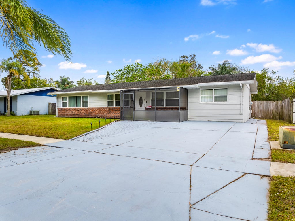 Photo of 340 NE Solida Drive, Port Saint Lucie, FL 34983 (MLS # R11076623)
