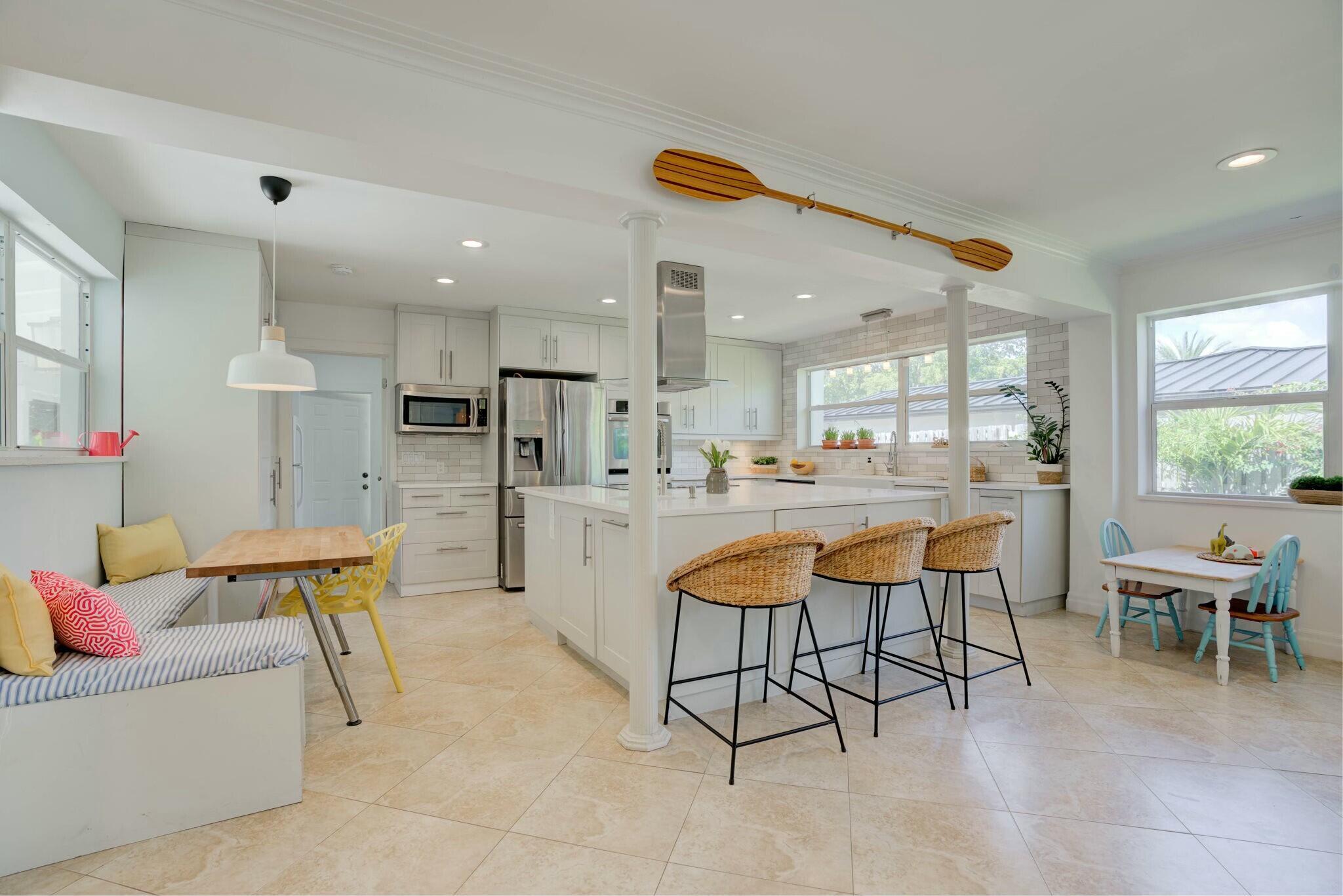 AVAILABLE 9/12/2025-10/25/25 - Beautiful North Palm Beach Pool Home located in a quiet and beautiful neighborhood. Fully furnished. 3 bedroom, 2 bath home with oversized entertaining spaces. Modern chefs' kitchen with two large islands, white quartz countertops, and stainless steel appliances. Large dining room table seats 10, breakfast nook in kitchen for children and families. Outdoor dining and seating, large sliders overlooking fully fenced yard, full laundry room. AC garaged space overlooking the pool. Fully fenced yard. Boat storage on side of house. Gorgeously landscaped yard, putting green, large pool, ping pong table, gardens, sandbox and fruit trees galore. Bike ride away to North Palm Beach golf course, country club swimming pool and Farm to Table restaurant.