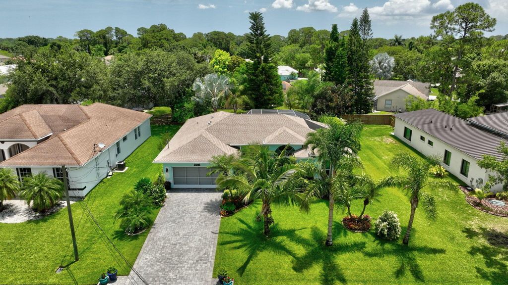 Photo of 2381 SW Indigo Lane, Port Saint Lucie, FL 34953 (MLS # R11094650)