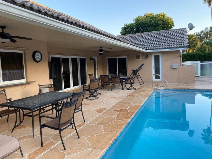 Beautiful home  in nice neighborhood with large salt water pool. Tile and wood flooring through out. Nice updated bathrooms. Three special water filters through the house. The sprinklers water come from the lake. Has high impact windows installed. Easy access to Sawgrass Expressway and the sunset view.