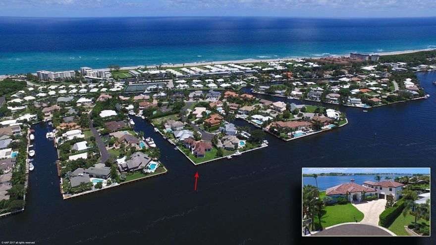 Deep Water Boating and Waterfront Living Are Yours in Upscale Ocean Ridge! Rare opportunity to own one of the premier point lot homes which offers spectacular wide water views from 247' of waterfront including 100' of direct intracoastal.  As you arrive at the end of this beautiful, quiet cul-de-sac and drive onto the brick paved entry of this incredible 4 bedroom, 3.5 bath custom home you can see your dream of a waterfront lifestyle taking shape before your eyes. Enter the front door to the open floor plan featuring solid wood flooring throughout the home, and let your eyes take in the smooth flow between rooms.