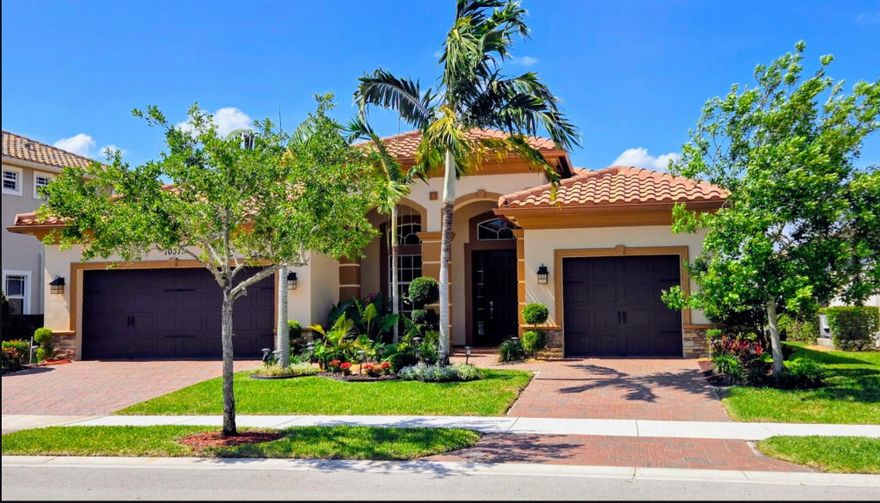Buyers agents welcome. Enjoy stunning lakefront views from this move-in ready premium 3-way split home. Featuring 4 bedrooms and 3 full bathrooms, this residence combines comfort, elegance, and functionality. The home is equipped with full impact windows and doors, crown molding, custom window treatments, and high-end ceiling fans throughout. The gourmet kitchen is designed for both everyday living and entertaining, offering granite countertops, GE stainless steel appliances, a double oven, and a gas stove. The spacious primary suite includes customized walk-in closets, while the oversized primary bath features dual sinks, a tiled shower, and a relaxing jacuzzi tub.  Additional highlights include: Formal dining room, Full-size laundry room with gas dryer, Tankless gas water heater, and Wired alarm system. Step outside to a large paver patio with room for a pool, perfect for enjoying the lakefront setting. The home has been freshly painted inside and out, with all pavers newly sealed. The HOA covers lawn maintenance and irrigation, providing ease and convenience. Located in an exclusive 24-hour guard-gated community, residents enjoy resort-style amenities including: Two clubhouses Fitness centers Pools and spas Tennis and basketball courts And more Conveniently close to shopping, dining, major highways, and A-rated schools: Elementary: Park Trails Middle: Westglades High: Marjory Stoneman Douglas