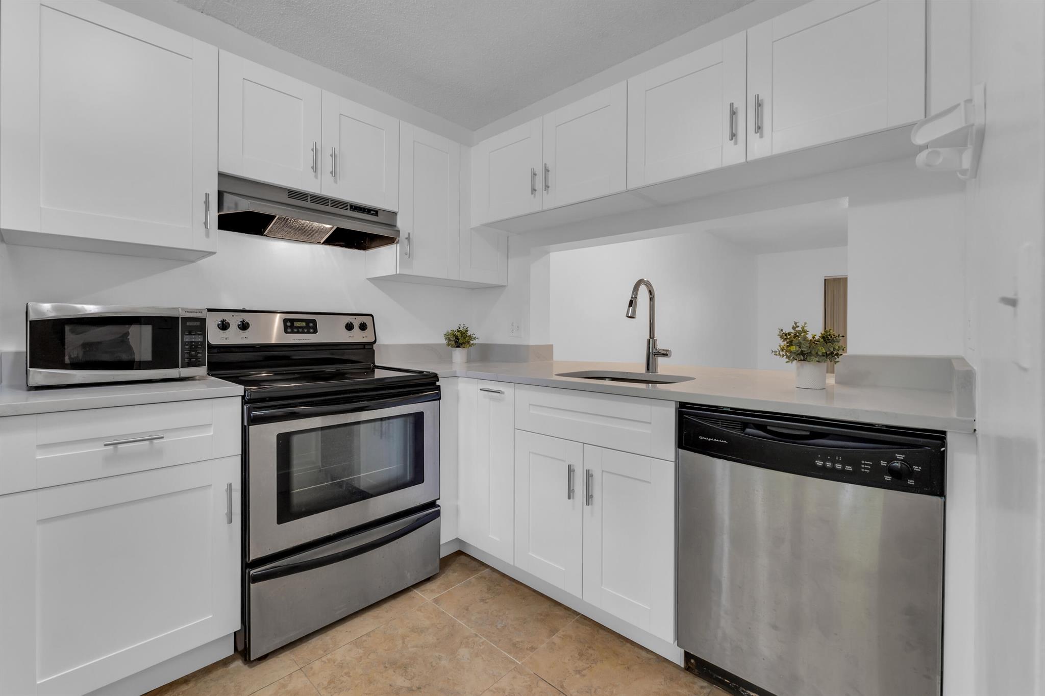 This Corner unit has a NEW KITCHEN, new refrigerator. Clean and with lake view this unit has all. Ceramic tile throughout , stainless steel appliances. 2 Suites. Ideal for roommate. Newer bathrooms. Non-smokers only. Gated Community, Pool, Jacuzzi , clubhouse. Easy to show. All ages. Pet ok