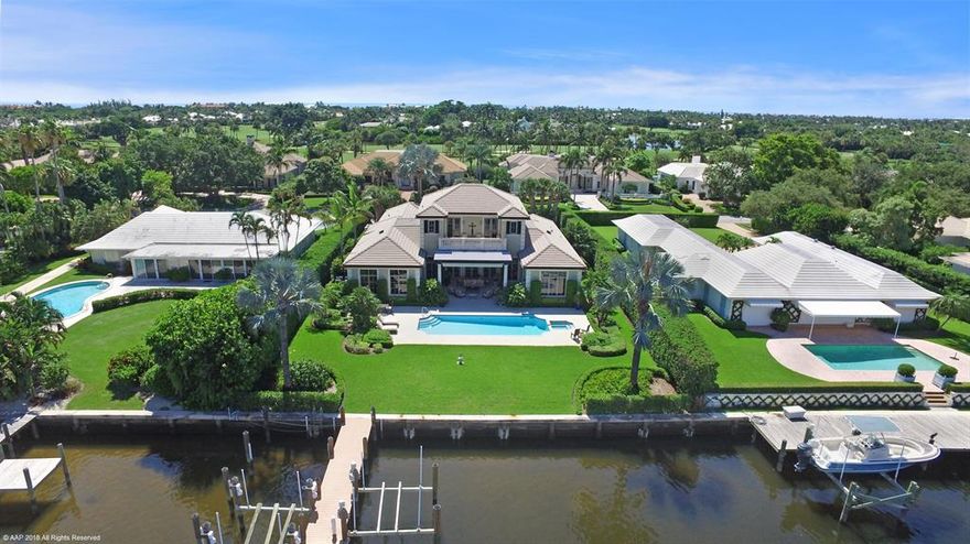 Custom designed residence situated on Little Lake Worth with stunning water views and access to the Atlantic Ocean. This home has 3 bedrooms, plus a den as an optional 4th bedroom. A large family room with a Chef's kitchen and custom bar is perfect for entertaining family and friends in this waterfront home.  Impact glass and a full house generator make this a very secure home.