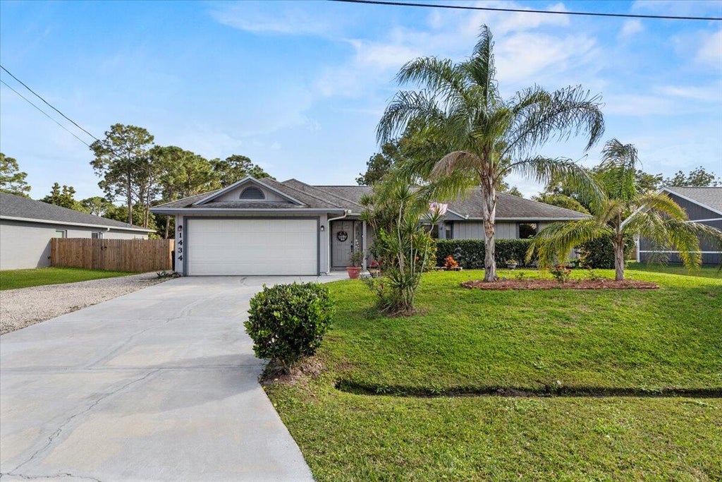 Photo of 1434 SW Glastonberry Avenue, Port Saint Lucie, FL 34953 (MLS # R10955765)