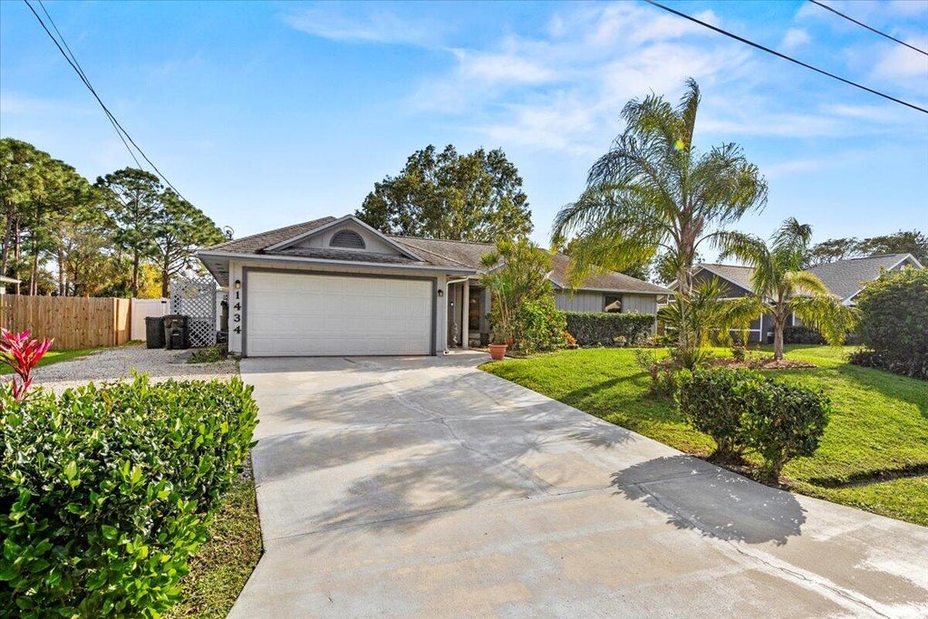 Photo of 1434 SW Glastonberry Avenue, Port Saint Lucie, FL 34953 (MLS # R10955765)