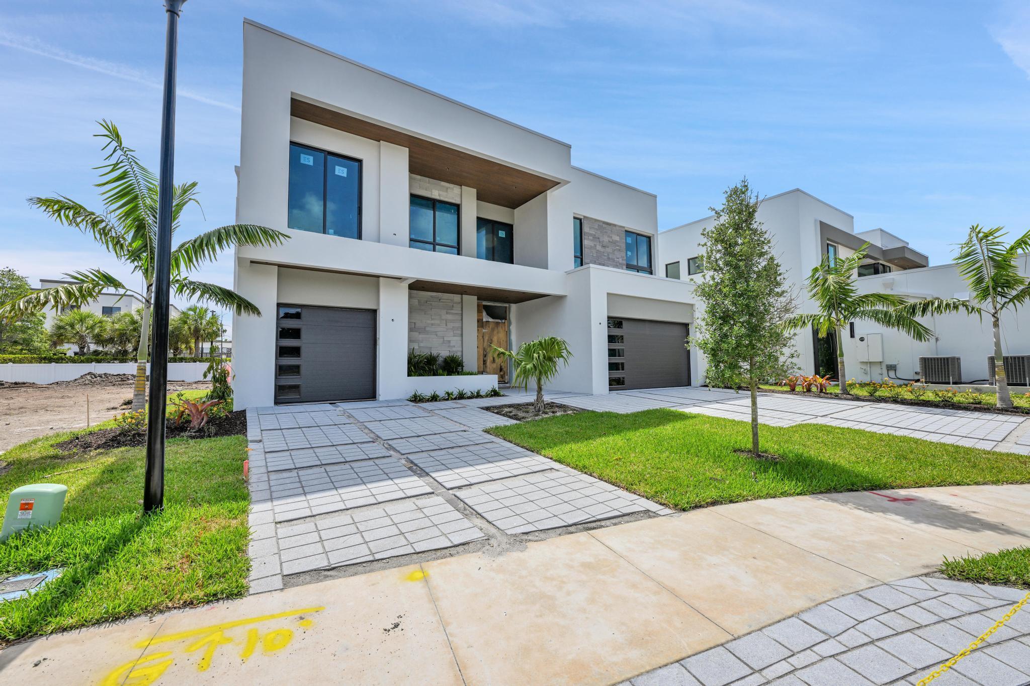 This stunning, new construction home in the heart of Delray Beach blends modern luxury with tranquility. Nestled in a serene, private community, it boasts top-of-the-line finishes, expansive open spaces, and high-end upgrades throughout. The chef-inspired kitchen, designer bathrooms, and sleek, contemporary interiors offer the perfect balance of style and functionality. Enjoy indoor-outdoor living with a spacious patio and lush landscaping. Located just minutes from vibrant shops, dining, and beaches, this home provides a rare combination of privacy, luxury, and convenience. Spacious master suite is located upstairs. This home is being offered with a pool for an additional cost. Estimated completion is Summer 2025. 1.5% Builder Fee.