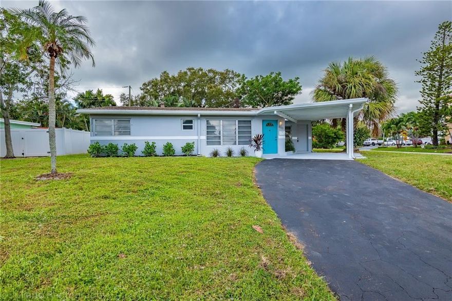 Amazing opportunity in prestigious area of The Cove/Deerfield Beach, this beautiful 3 bedroom 2 bath home is less than a mile to the beach. Perfect corner lot for a family or as a rental/Airbnb investment, with large yard, carport and extra shed. Home is ready to move in showing beautiful upgrades, such as new a/c, newer roof, an accent shiplap wall in living area, white wood soft closing cabinets, quartz counters, SS appliances, waterproof flooring, modern fixtures, fresh paint, fresh landscaping and much more.  Minutes to restaurants, shops, pier, 10th St (& all highways), and walking distance to Target. Priced 100K below the lowest listing in the area. Don't miss this great opportunity! Bring your boat and enjoy the Florida East living life style!