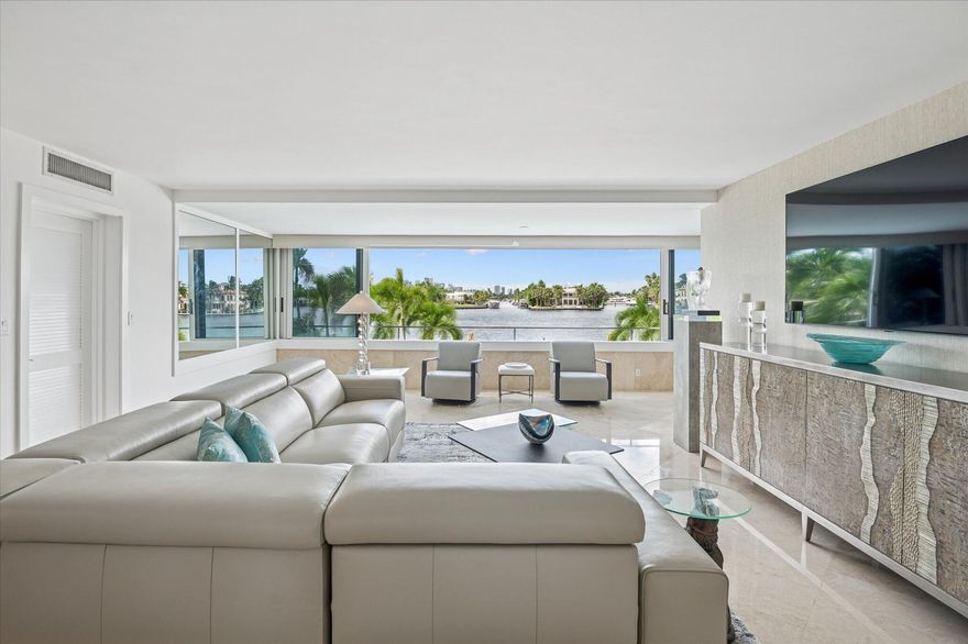 Incredible close up Intracoastal views unfold through wall to wall slider windows; magnificent day or night. This light filled corner residence has been tastefully updated with a new kitchen, quartzite countertops, marble floors in the living areas, carpeted bedroom. The Versailles is a boutique building just a block from the beach, ideally located near top Las Olas and beachside restaurants, the Water Taxi, and Fort Lauderdale airport.  A well run building with a new roof, updated pool and expansive deck, and strong reserves. And again, the views are amazing.