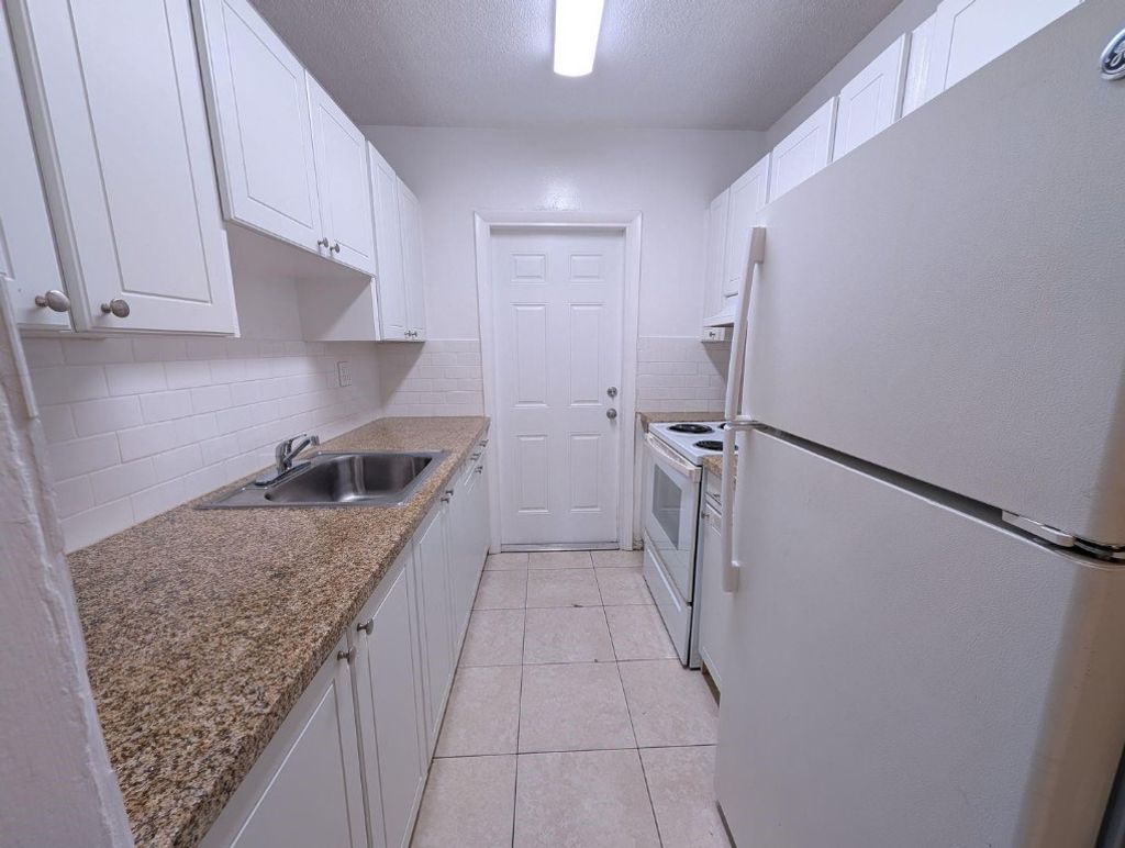 Photo of 481 Sunshine Drive #C1, Coconut Creek, FL 33066 (MLS # F10531054)