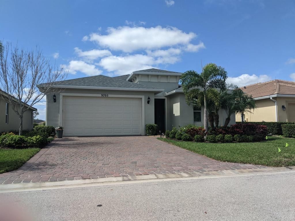 Photo of 9705 SW Royal Poinciana Drive, Port Saint Lucie, FL 34987 (MLS # R10701916)